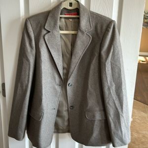 Women’s blazer by Halston III. Two button lined